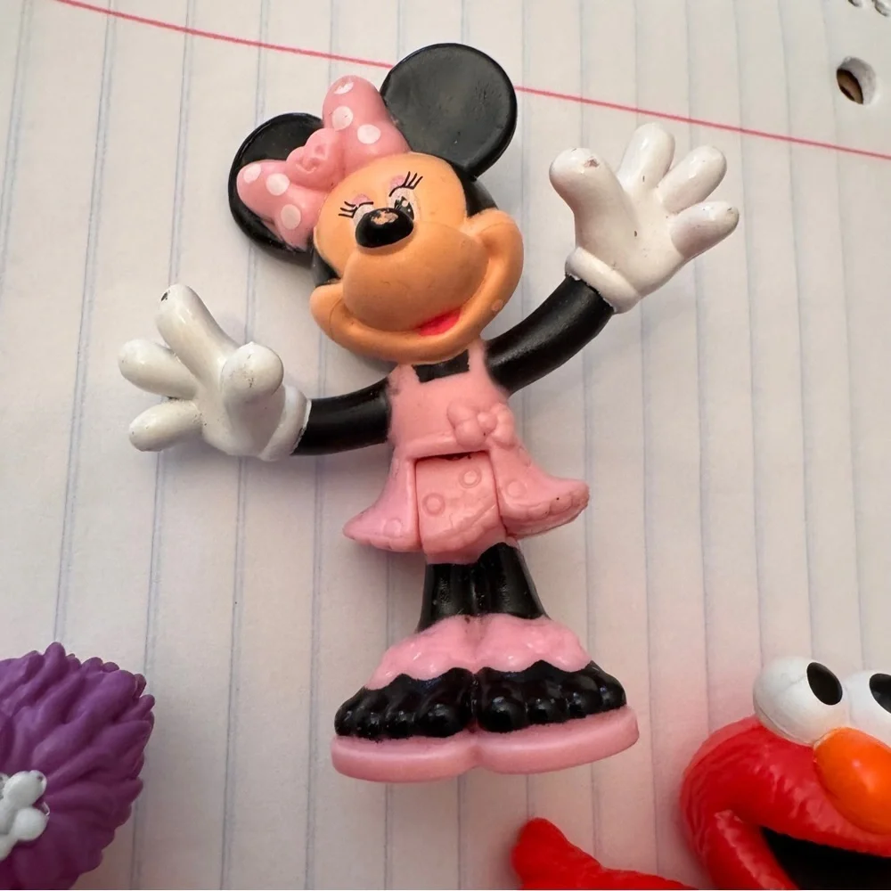 Colorful Sesame Street Neighborhood Friends and Minnie Mouse figurines